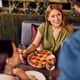 Friends Enjoying Pizza and Wine at an Outdoor Restaurant During the Day Friends Enjoying Pizza and Wine at an Outdoor Restaurant During the Day - PhotoDune Item for Sale