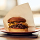 Delicious Cheeseburger with Juicy Beef Patty Served on a Plate in Bright Lighting Delicious Cheeseburger with Juicy Beef Patty Served on a Plate in Bright Lighting - PhotoDune Item for Sale