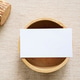 Flat lay of branding identity business name card on wooden container with fabric background, minimal Flat lay of branding identity business name card on wooden container with fabric background, minimal - PhotoDune Item for Sale