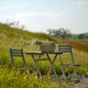 Outdoor picnic countryside wooden table chair wicker basket wildflower sunny meadow rustic scene wit Outdoor picnic countryside wooden table chair wicker basket wildflower sunny meadow rustic scene wit - PhotoDune Item for Sale