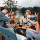 Friend drink picnic lake camping group enjoying outdoor toast beside lake at sunset Friend drink picnic lake camping group enjoying outdoor toast beside lake at sunset - PhotoDune Item for Sale