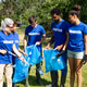 Diverse volunteers cleaning up park with trash bags Diverse volunteers cleaning up park with trash bags - PhotoDune Item for Sale