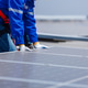 Technicians are installing and inspecting standards of solar panels on roof of an industrial factory Technicians are installing and inspecting standards of solar panels on roof of an industrial factory - PhotoDune Item for Sale