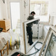 Portrait of a working man preparing a window frame for installation in a basement kitchen. Portrait of a working man preparing a window frame for installation in a basement kitchen. - PhotoDune Item for Sale