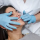 Dentist examines patient's gums during dental checkup in clinic Dentist examines patient's gums during dental checkup in clinic - PhotoDune Item for Sale