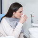 Patient rinsing mouth with water after dental treatment in clinic setting Patient rinsing mouth with water after dental treatment in clinic setting - PhotoDune Item for Sale