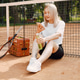 Young female tennis player relax after match Young female tennis player relax after match - PhotoDune Item for Sale