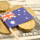 Stack of coins with Australia flag and US dollar banknotes. Stack of coins with Australia flag and US dollar banknotes. - PhotoDune Item for Sale