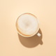 Coffee cup cappuccino foam at colored background with hard shadow. Coffee cup cappuccino foam at colored background with hard shadow. - PhotoDune Item for Sale