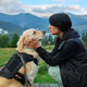 Woman and dog share a moment in the Carpathians during vacation in the evening light Woman and dog share a moment in the Carpathians during vacation in the evening light - PhotoDune Item for Sale