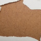 Ripped paper opening mockup on rustic brown fiberboard with copy space Ripped paper opening mockup on rustic brown fiberboard with copy space - PhotoDune Item for Sale