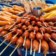 Grilled thai sausages or Lock ching in a marinated sauce, a popular street food. Grilled thai sausages or Lock ching in a marinated sauce, a popular street food. - PhotoDune Item for Sale