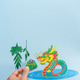 Vertical photo of Chinese Dragon Boat Festival tradition with dragon symbol and zongzi rice dumpling Vertical photo of Chinese Dragon Boat Festival tradition with dragon symbol and zongzi rice dumpling - PhotoDune Item for Sale