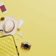 Summer travel accessories flat lay on yellow background Summer travel accessories flat lay on yellow background - PhotoDune Item for Sale