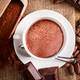 Hot chocolate drink with cocoa ingredients on rustic burlap Hot chocolate drink with cocoa ingredients on rustic burlap - PhotoDune Item for Sale
