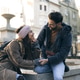 Tourist Couple Sitting And Talking Tourist Couple Sitting And Talking - PhotoDune Item for Sale