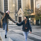 Tourist Couple Holding Hands And Walking Tourist Couple Holding Hands And Walking - PhotoDune Item for Sale