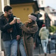Tourist Couple Walking And Drinking Coffee Tourist Couple Walking And Drinking Coffee - PhotoDune Item for Sale
