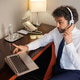 Surprised Businessman in Headset Looking at Laptop During Video Call Surprised Businessman in Headset Looking at Laptop During Video Call - PhotoDune Item for Sale