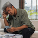 Stressed senior man calculating expenses and money problems Stressed senior man calculating expenses and money problems - PhotoDune Item for Sale