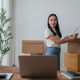 Young woman managing online orders from home office Young woman managing online orders from home office - PhotoDune Item for Sale