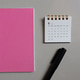 Minimal pink notebook flat lay for modern lifestyle and planning. Minimal pink notebook flat lay for modern lifestyle and planning. - PhotoDune Item for Sale