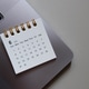 Calendar on Laptop Keyboard. Business Planing and Workspace Concept. Calendar on Laptop Keyboard. Business Planing and Workspace Concept. - PhotoDune Item for Sale