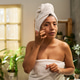 Portrait of Hispanic Adult Woman Applying Skincare during Routine Portrait of Hispanic Adult Woman Applying Skincare during Routine - PhotoDune Item for Sale