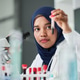Portrait of Asian Woman Examining Blood Sample in Lab Portrait of Asian Woman Examining Blood Sample in Lab - PhotoDune Item for Sale