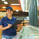 Portrait of Hispanic Woman Working in Supermarket Inventory Portrait of Hispanic Woman Working in Supermarket Inventory - PhotoDune Item for Sale