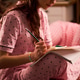 Teenage Girl Writing in Notebook during Sleepover Journaling Teenage Girl Writing in Notebook during Sleepover Journaling - PhotoDune Item for Sale