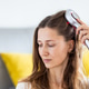 Woman using hair treatment device at home Woman using hair treatment device at home - PhotoDune Item for Sale