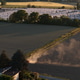 Italian Po Valley agricultural landscape at sunset, featuring irrigation on dry farmland amidst drou Italian Po Valley agricultural landscape at sunset, featuring irrigation on dry farmland amidst drou - PhotoDune Item for Sale