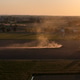 Farming tractor plowing dry agricultural field at sunset, creating dust plume in Po Valley, Italy, h Farming tractor plowing dry agricultural field at sunset, creating dust plume in Po Valley, Italy, h - PhotoDune Item for Sale