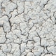 The surface of the earth was cracked by drought, cracks and erosion in the soil. Brown dry soil or c The surface of the earth was cracked by drought, cracks and erosion in the soil. Brown dry soil or c - PhotoDune Item for Sale