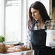 Smiling Female Baker Holding Fresh Artisan Sourdough Bread in Bakery Smiling Female Baker Holding Fresh Artisan Sourdough Bread in Bakery - PhotoDune Item for Sale