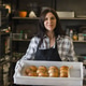 Smiling Female Baker Holding Fresh Artisan Sourdough Bread in Bakery Smiling Female Baker Holding Fresh Artisan Sourdough Bread in Bakery - PhotoDune Item for Sale