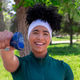Smiling woman training with dumbbell in park Smiling woman training with dumbbell in park - PhotoDune Item for Sale