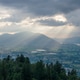 Sun Rays Breaking Through Clouds Over Forested Valley And Mountain Near Chilliwack, British Columbia Sun Rays Breaking Through Clouds Over Forested Valley And Mountain Near Chilliwack, British Columbia - PhotoDune Item for Sale
