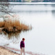 Mature Woman Walking Along Lakeshore During Nature Retreat Vertical Mature Woman Walking Along Lakeshore During Nature Retreat Vertical - PhotoDune Item for Sale