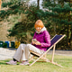 Mature Woman Using Smartphone While Relaxing On Deck Chair Outdoors Mature Woman Using Smartphone While Relaxing On Deck Chair Outdoors - PhotoDune Item for Sale