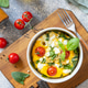 Baked egg omelette with spinach, cherry tomato and feta cheese on a stone surface. Healthy vegetaria Baked egg omelette with spinach, cherry tomato and feta cheese on a stone surface. Healthy vegetaria - PhotoDune Item for Sale