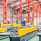 Young female engineer inspecting metal sheet roll forming production line with tablet in factory Young female engineer inspecting metal sheet roll forming production line with tablet in factory - PhotoDune Item for Sale