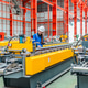 Young female engineer inspecting metal sheet roll forming production line with tablet in factory Young female engineer inspecting metal sheet roll forming production line with tablet in factory - PhotoDune Item for Sale