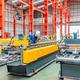 Young female engineer inspecting metal sheet roll forming production line with tablet in factory Young female engineer inspecting metal sheet roll forming production line with tablet in factory - PhotoDune Item for Sale
