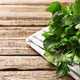Fresh parsley on wooden table, closeup. Space for text Fresh parsley on wooden table, closeup. Space for text - PhotoDune Item for Sale