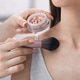 Makeup artist applying powder on woman's body indoors, closeup Makeup artist applying powder on woman's body indoors, closeup - PhotoDune Item for Sale