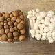 Raw brown and white shimeji mushrooms on wooden table, flat lay Raw brown and white shimeji mushrooms on wooden table, flat lay - PhotoDune Item for Sale