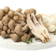 Cluster of raw shimeji mushrooms isolated on white Cluster of raw shimeji mushrooms isolated on white - PhotoDune Item for Sale