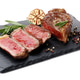 Cut tasty beef steak with spices and rosemary isolated on white Cut tasty beef steak with spices and rosemary isolated on white - PhotoDune Item for Sale